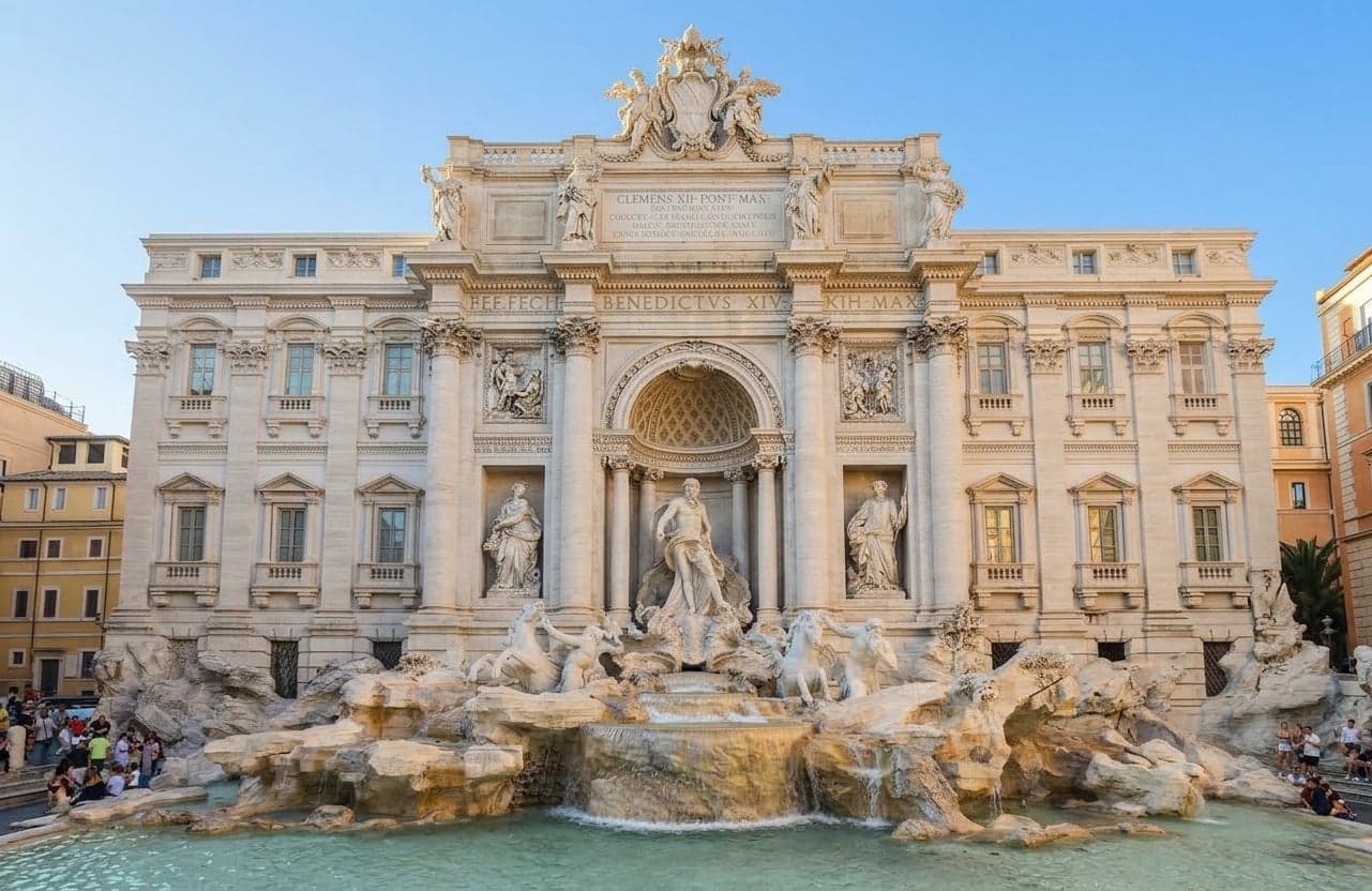 Trevi Fountain in Rome with clear blue water and baroque sculptures.